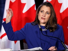 Finance Minister Chrystia Freeland gestures as she speaks during a news conference before delivering the 2022-23 budget, in Ottawa, on Thursday, April 7, 2022.