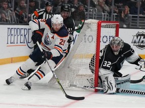 Apr 7, 2022; Los Angeles, California, USA; LA Kings goaltender Jonathan Quick (32) defends the goal against Edmonton Oilers center Leon Draisaitl (29) in the third period at Crypto.com Arena.