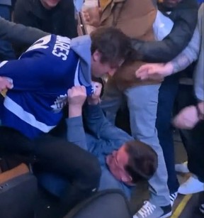 It starts.  A Leafs fan wearing a Tavares jersey punches another fan he accuses of groping a woman.  (Buzz/Twitter sheets)