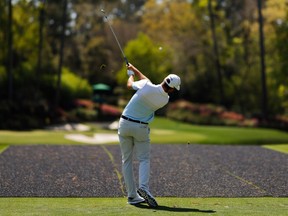 Canada's Corey Conners hits his tee shot on the 12th hole during a practice round.