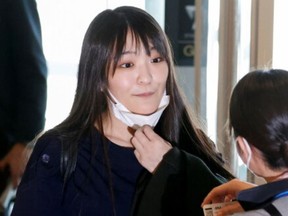 Former Japanese princess Mako Komuro is pictured at the Haneda airport in Tokyo on Nov. 14, 2021.