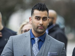 Toronto Police Const. Sameer Kara waits in line to enter the courthouse at 361 University Ave. in Toronto, Ont., on Monday, May 29, 2017.