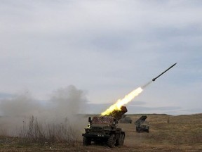 A Ukrainian multiple rocket launcher BM-21 "Grad" shells Russian troops' position, near Lugansk, in the Donbas region, on April 10, 2022.