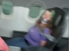 A screengrab from a TikTok video shows a woman duct-taped to an airline seat. (Arieana Mathena/TikTok)
