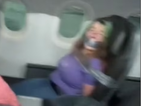 A screengrab from a TikTok video shows a woman duct-taped to an airline seat.