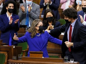 Canada's Finance Minister Chrystia Freeland hugs Prime Minister Justin Trudeau, after delivering the 2022-23 budget in the House of Commons on Parliament Hill in Ottawa, Ontario, Canada, April 7, 2022.