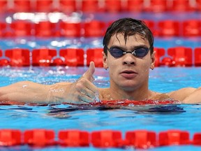 Tokyo 2020 Olympics - Swimming - Men's 100m Backstroke - Final - Tokyo Aquatics Centre - Tokyo, Japan - July 27, 2021. Evgeny Rylov of the Russian Olympic Committee celebrates after winning the gold medal.