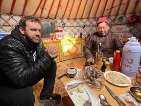 Steve Sir enjoys a meal inside a yurt in the Mongolian countryside.