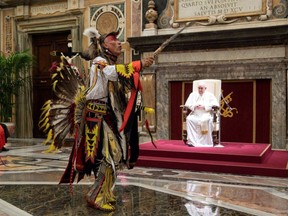 The final audience stands with Pope Francis and members of the Indigenous delegation where the Pontiff delivered an apology for the Catholic Church’s role in Canada's residential school system, at the Vatican, Friday, April 1, 2022.