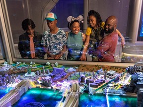 Epcot guests learn about Xandarian culture in the Xandar Gallery, part of Guardians of the Galaxy: Cosmic Rewind, the new family-thrill coaster attraction at Walt Disney World Resort in Lake Buena Vista, Fla.