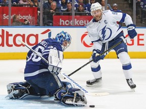 Jack Campbell of the Toronto Maple Leafs makes a save as Steven Stamkos of the Tampa Bay Lightning looks for a rebound during Game 5 of the First Round of the 2022 Stanley Cup Playoffs at Scotiabank Arena on May 10, 2022 in Toronto.