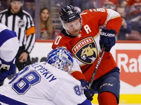 Tampa Bay Lightning goaltender Andrei Vasilevskiy clears the puck away from Florida Panthers right winger Patric Hornqvist.
