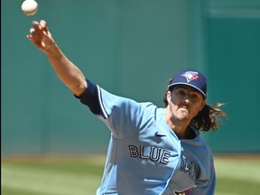 Blue Jays starting pitcher Kevin Gausman throws a pitch during the first inning against the Cleveland Guardians at Progressive Field.