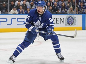 Auston Matthews of the Toronto Maple Leafs looks for a puck against the Tampa Bay Lightning during Game Five of the First Round of the 2022 Stanley Cup Playoffs at Scotiabank Arena on May 10, 2022 in Toronto, Ontario, Canada.