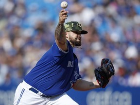 Alek Manoah of the Toronto Blue Jays pitches in the seventh inning of their MLB game against the Cincinnati Reds at Rogers Centre on May 21, 2022 in Toronto, Canada.