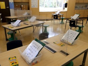 Plexiglass dividers are set up on tables in a first grade classroom at Bryant Elementary School on April 09, 2021 in San Francisco, California. The San Francisco Unified School District is preparing to gradually return students back to classrooms next week.