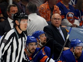 Head coach Barry Trotz of the New York Islanders watches his team play against the Tampa Bay Lightning during the first period of Game Four of the Stanley Cup Semifinals during the 2021 Stanley Cup Playoffs at Nassau Coliseum on June 19, 2021 in Uniondale, New York.