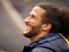 Colin Kaepernick interacts with fans during the Michigan spring football game at Michigan Stadium on April 2, 2022 in Ann Arbor, Michigan.