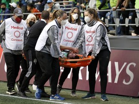 João Paulo #6 of Seattle Sounders is brought off the field during 2022 Scotiabank Concacaf Champions League Final Leg 2 against Pumas at Lumen Field on May 4, 2022 in Seattle, Washington.