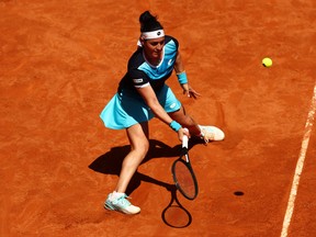 Ons Jabeur of Tunisia plays a forehand in her semifinal match against Ekaterina Alexandrova during day eight of the Mutua Madrid Open at La Caja Magica on May 5, 2022 in Madrid, Spain.