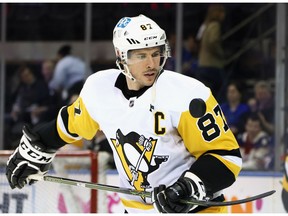 Sidney Crosby of the Pittsburgh Penguins plays with the puck during warm-ups prior to playing against the New York Rangers in Game Five of the First Round of the 2022 Stanley Cup Playoffs at Madison Square Garden on May 11, 2022 in New York City.