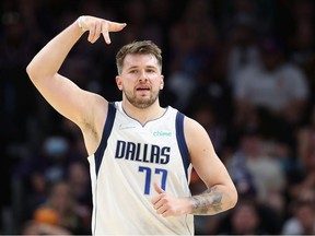 Luka Doncic of the Dallas Mavericks reacts to a three-point shot against the Phoenix Suns during the second half of Game Seven of the Western Conference Second Round NBA Playoffs at Footprint Center on May 15, 2022 in Phoenix, Arizona.