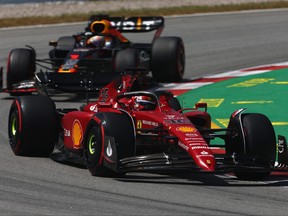 Charles Leclerc of Monaco driving the (16) Ferrari F1-75 leads Max Verstappen of the Netherlands driving the (1) Oracle Red Bull Racing RB18 during the F1 Grand Prix of Spain at Circuit de Barcelona-Catalunya on May 22, 2022 in Barcelona, Spain.
