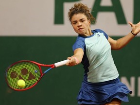 Jasmine Paolini of Italy plays a forehand against  Irina-Camelia Begu of Romania during the Women's Singles First Round match on Day 2 of The 2022 French Open at Roland Garros on May 23, 2022 in Paris, France.