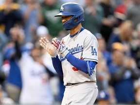 Mookie Betts of the Los Angeles Dodgers celebrates after hitting a three-run home run in the second inning against the Washington Nationals at Nationals Park on May 24, 2022 in Washington, DC.