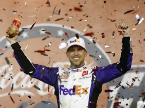 Denny Hamlin, driver of the #11 FedEx Ground Toyota, celebrates in Victory Lane after winning the NASCAR Cup Series Coca-Cola 600 at Charlotte Motor Speedway on May 29, 2022 in Concord, North Carolina. (Photo by Jared C. Tilton/Getty Images)