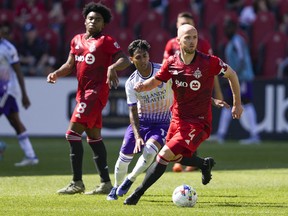 Toronto FC midfielder Michael Bradley moves the ball against Orlando City forward Facundo Torres.
