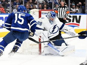 Tampa Bay Lightning goalie Andrei Vasilevskiy (88) makes a save on Toronto Maple Leafs forward Alexander Kerfoot (15) in game one of the first round of the 2022 Stanley Cup Playoffs at Scotiabank Arena.