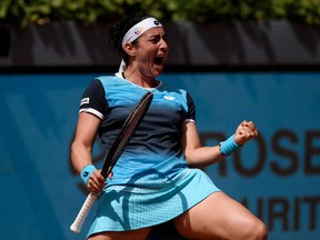 Tunisia's Ons Jabeur celebrates after winning the 2022 ATP Tour Madrid Open tennis tournament singles match against Romania's Simona Halep at the Caja Magica in Madrid on May 4, 2022.