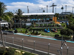 A man walks on the Formula One track ahead of the Miami Grand Prix in Miami Gardens, Florida on May 4, 2022.