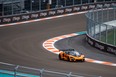 Engineers and officials drive a sport car on the Formula One track ahead of the Miami Grand Prix in Miami Gardens, Florida on May 4, 2022.