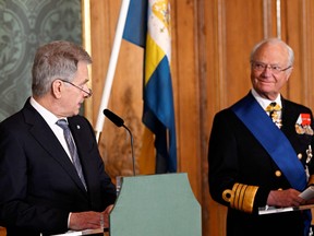 Finland's President Sauli Niinisto and Sweden's King Carl Gustaf deliver a statement at the Royal Palace, during a two-day state visit of Niinisto to Sweden, in Stockholm, Sweden May 17, 2022.