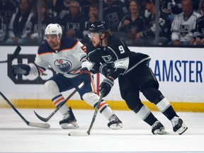 Adrian Kempe #9 of the Los Angeles Kings skates the puck against the Edmonton Oilers in the first period of Game Four of the First Round of the 2022 Stanley Cup Playoffs at Crypto.com Arena