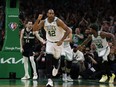 Celtics centre Al Horford (42) pumps his fist as he heads back up court after hitting a basket against the Bucks during the second half of Game 7 of the second round of the 2022 NBA playoffs at TD Garden in Boston, May 15, 2022.