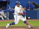 Blue Jays designated hitter Alejandro Kirk hits a two-run home run against the White Sox during the fifth inning at Rogers Centre in Toronto, Tuesday, May 31, 2022.