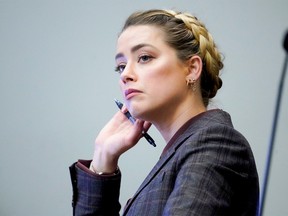 Amber Heard listens in the courtroom at the Fairfax County Circuit Court in Fairfax, Va., on May 2, 2022.