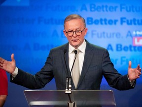 Australian opposition leader Anthony Albanese gestures as he addresses Labor supporters after winning the 2022 general election at the Federal Labour Reception in Sydney, Saturday, May 21, 2022.