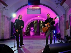 Bono, Irish singer-songwriter, activist, and the lead vocalist of the rock band U2, and guitarist David Howell Evans aka "The Edge," perform at subway station which is bomb shelter, in the center of Ukrainian capital of Kyiv on May 8, 2022.