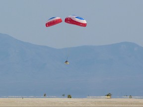 In this handout image courtesy of NASA, Boeings CST-100 Starliner spacecraft lands at White Sands Missile Ranges Space Harbor, May 25, 2022, in New Mexico.