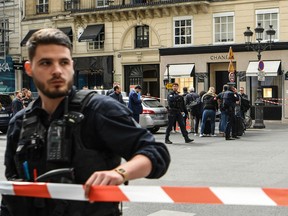 Police set up a security cordon near the entrance to a Chanel shop on Place Vendome in Paris, on May 5, 2022, after a suspected armed robbery.