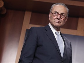 Senate Majority Leader Chuck Schumer (D-NY) listens as Debbie Stabenow (D-MI) speaks at a press conference on the Senate’s upcoming  procedural vote to codify Roe v. Wade at the U.S. Capitol Building on May 5, 2022 in Washington, D.C.