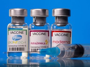 Vials with Pfizer-BioNTech, AstraZeneca, and Moderna COVID-19 vaccine labels are seen in this illustration picture taken March 19, 2021.