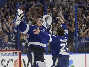 Tampa Bay Lightning defenceman Ryan McDonagh and goaltender Andrei Vasilevskiy celebrate the team's Stanley Cup finals series in Game 5 of the Stanley Cup last summer.