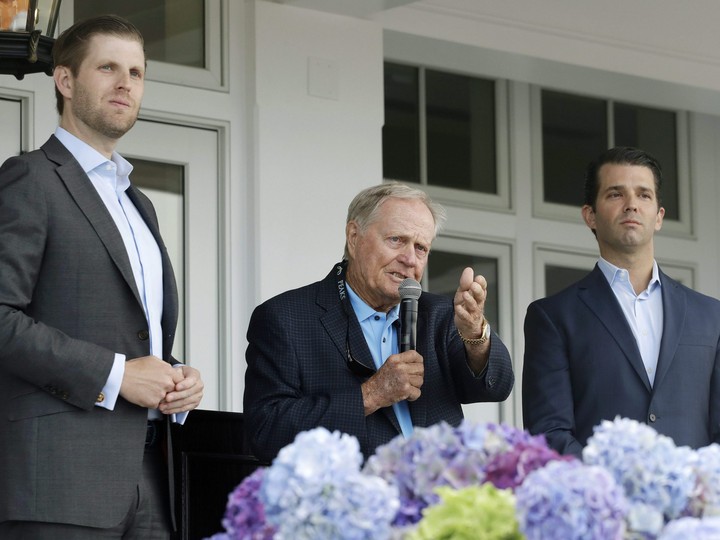  In this June 11, 2018 photo, Eric Trump, left, Jack Nicklaus, centre, and Donald Trump Jr. attend the opening of the Trump Golf Links clubhouse in the Bronx borough of New York. (AP Photo/Mark Lennihan)