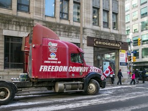 The words "Freedom Convoy 2022" are visible on a truck that is part of a demonstration against COVID-19 restrictions in Ottawa on Sunday, Feb. 13, 2022.