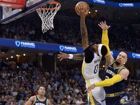 Memphis Grizzlies forward Dillon Brooks (24) fouls Golden State Warriors guard Gary Payton II (0) during the first half of Game 2 of a second-round NBA basketball playoff series Tuesday, May 3, 2022, in Memphis, Tenn. Brooks was ejected. (AP Photo/Brandon Dill)